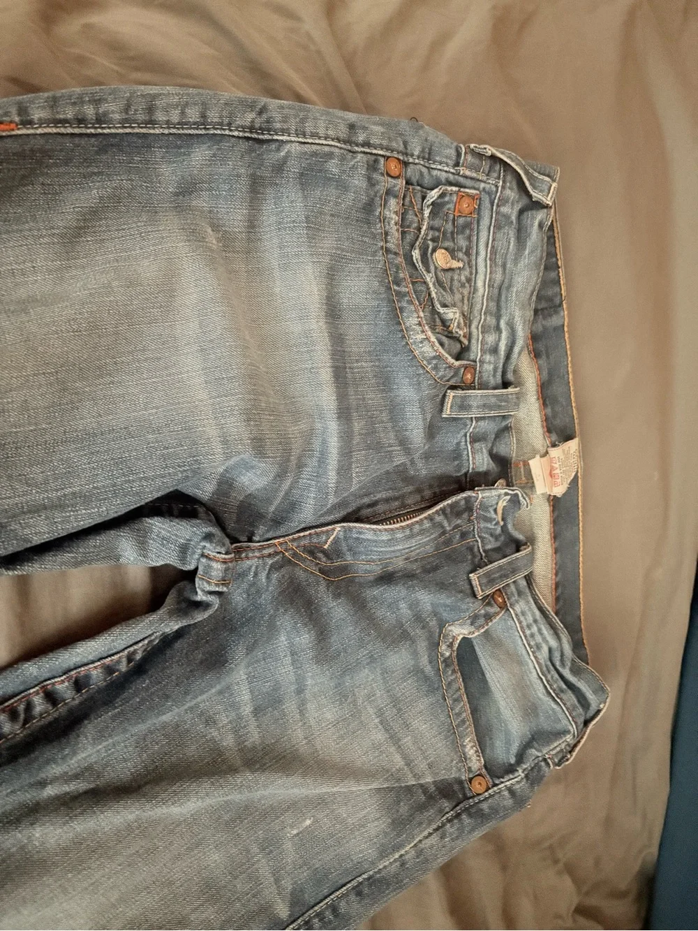 True Religion Men's Straight Jeans in Medium Blue with Distressed Hem
